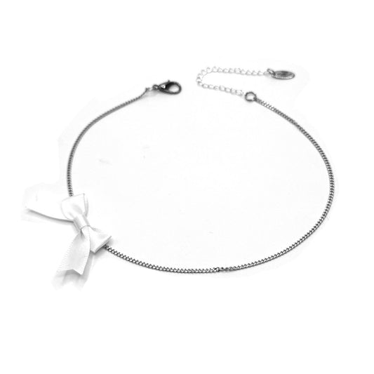 white bow necklace on white background