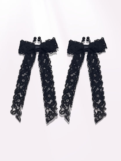 Bougee Black Lace Bow Nipple Clamps on Pink Background