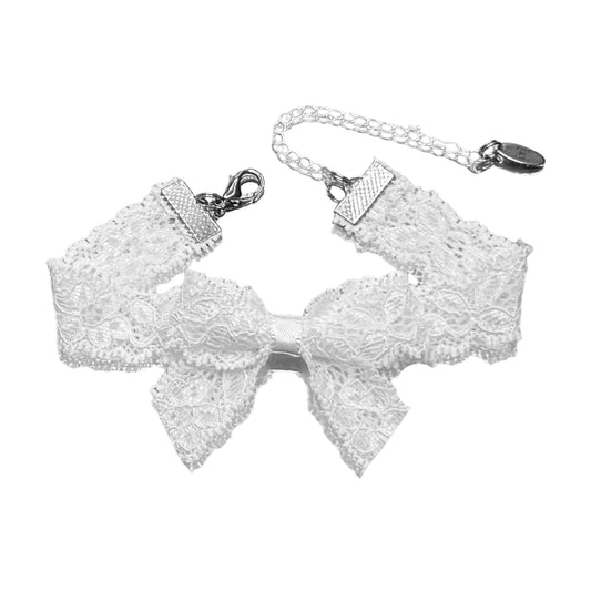 White lace bow anklet with a chain on a white background