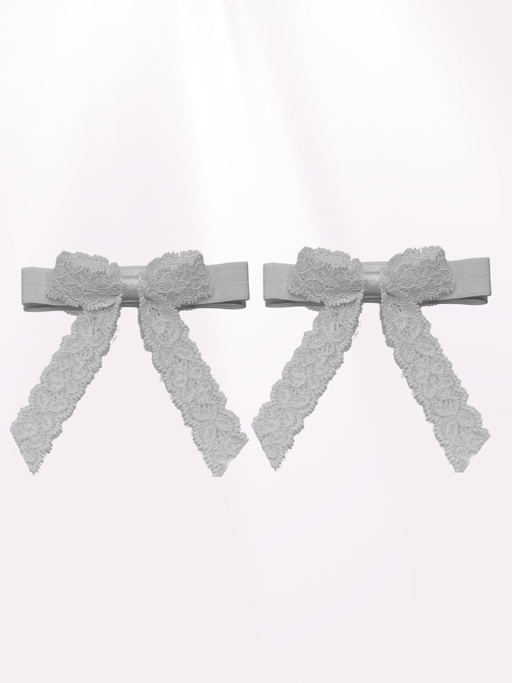 White Lace Heel Straps on Light Pink Background