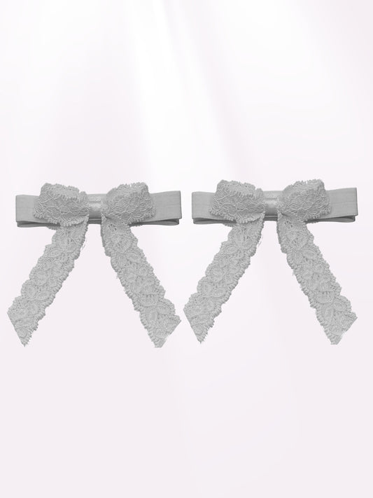 White Lace Heel Straps on Light Pink Background