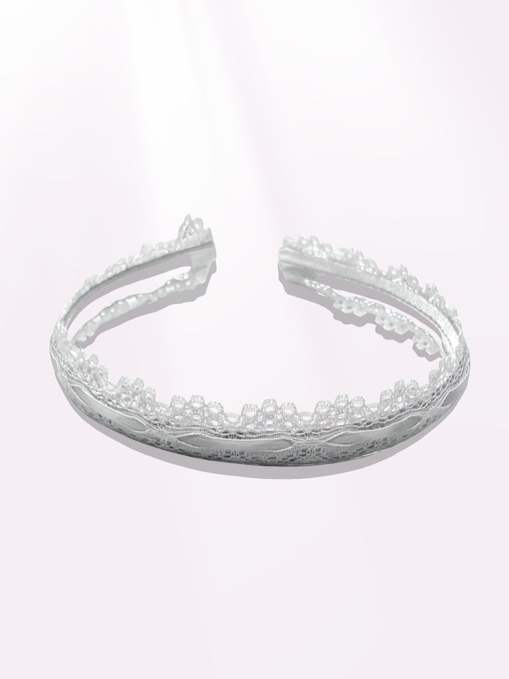 chantilly white lace headband on light pink background with satin bows