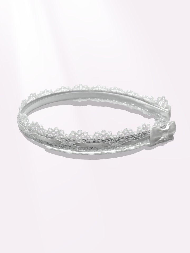 Side view of chantilly white lace headband with white bows