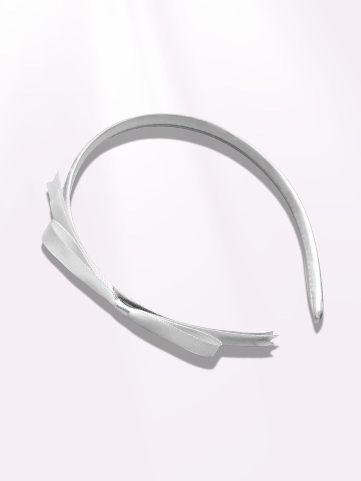 enchantress white hair bow band on light pink background