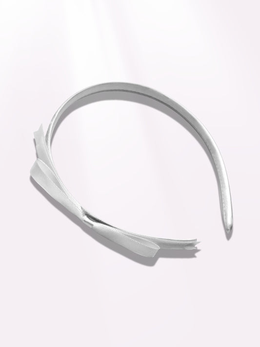 enchantress white hair bow band on light pink background