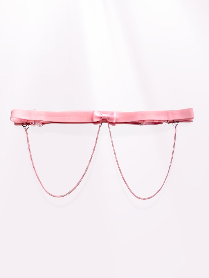 pink bow belt on light pink background