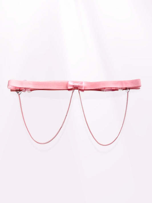 pink bow belt on light pink background