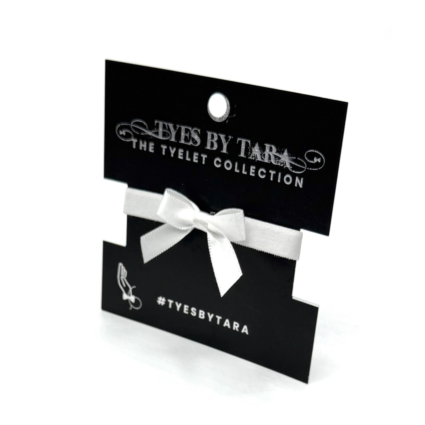 Packaging View of Kinkette White Bow Bracelet 