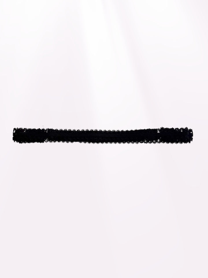 lady black bow belt on light pink background