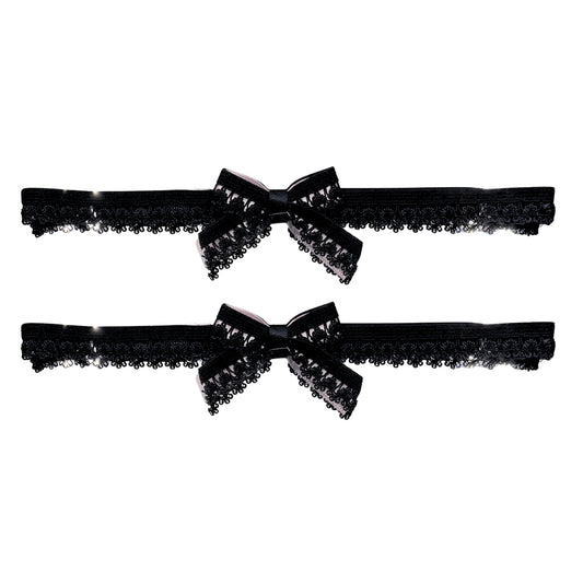 Two black lace bow garters with bows on a white background
