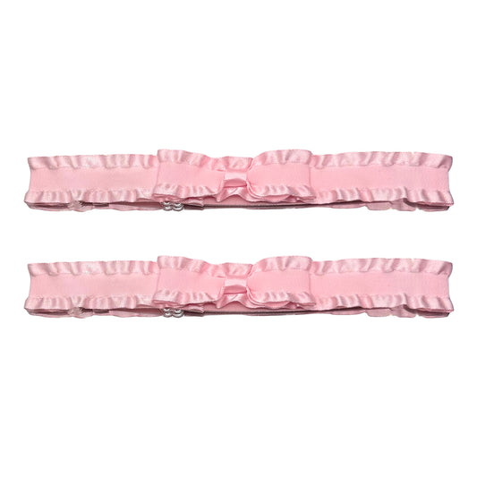pink ruffled leg garters on white background