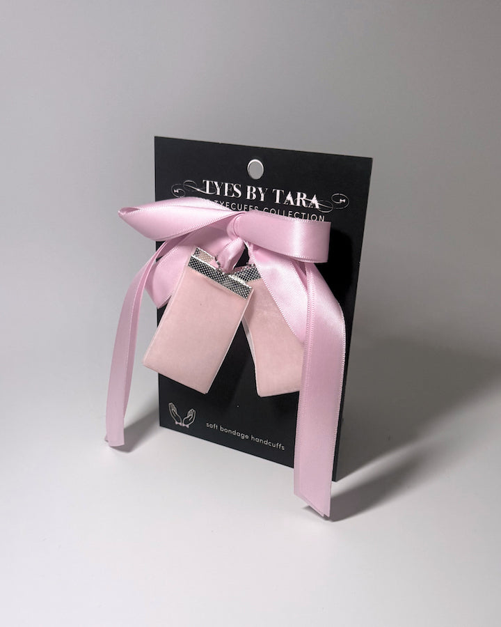 madame pink velvet soft bondage handcuffs on black card