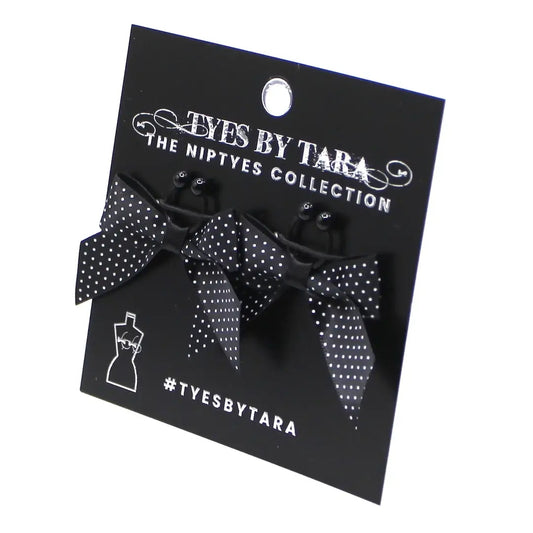 black pinup nipple clamps on black card on white background