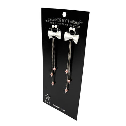 pearl nipple ties on black card