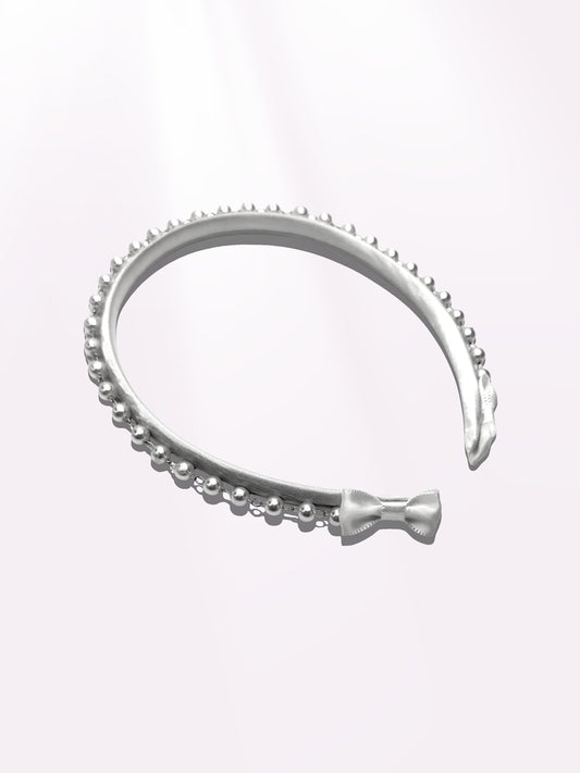 Pearl White Headband on Light Pink Background with White Bows