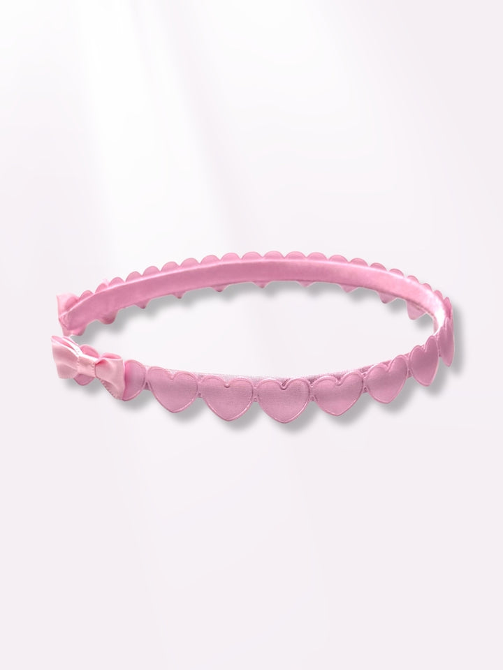 pink heart headband on side