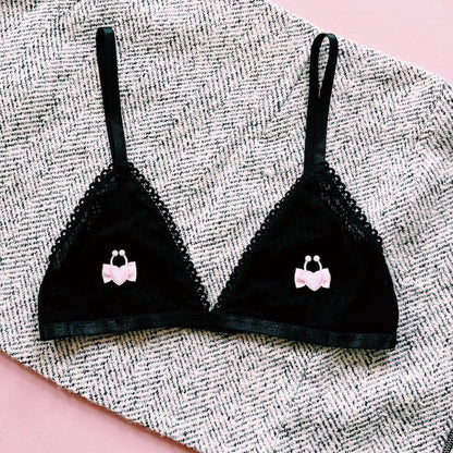 pink heart nipple clamps on black bra