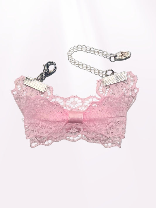 pink lace bracelet on light pink background