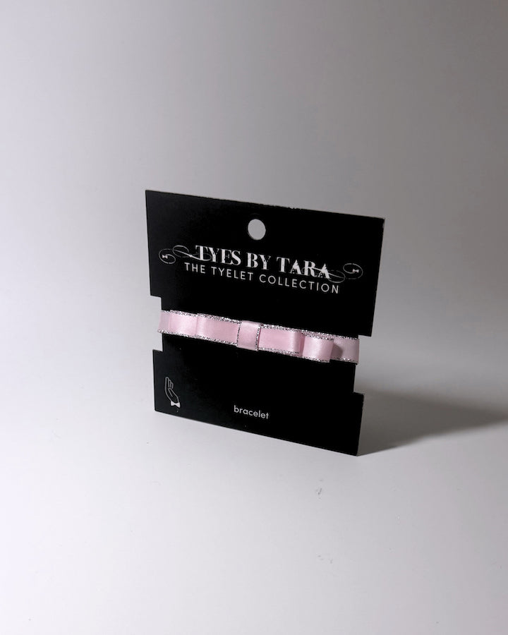 Pink Queen Bow Bracelet with Silver Metallic Trim on black card
