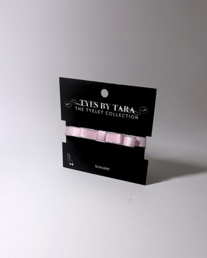 Pink Queen Bow Bracelet with Silver Metallic Trim on black card