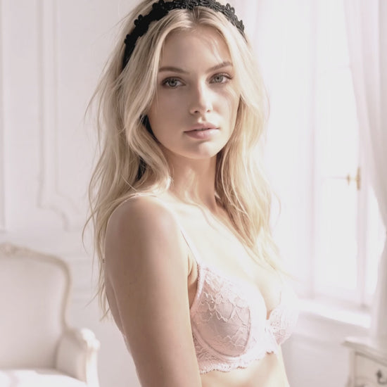 Blonde model in lingerie wearing the Black Flower Bow Headband in an elegant white boudoir