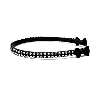 Black hairband with black and silver rhinestone mesh with black bows at the end on white background Side View