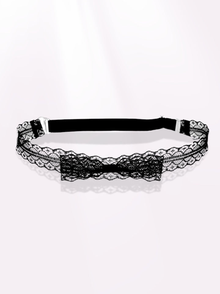 siren black lace bow belt on pink background 