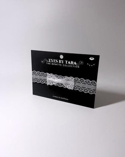 Siren White Lace Bow Choker on light gray background on black card