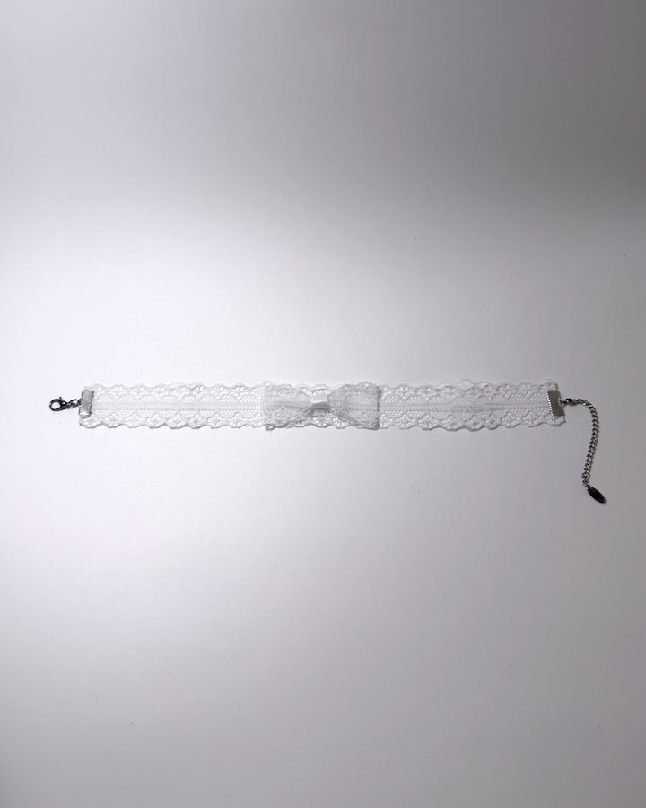 Siren White Lace Bow Choker on light gray background flatlay