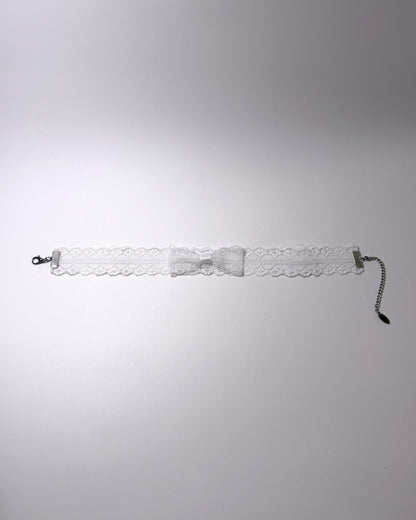 Siren White Lace Bow Choker on light gray background flatlay