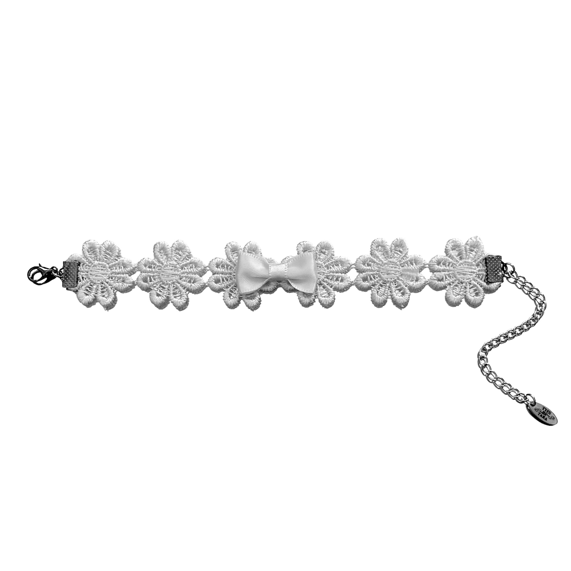 flay lay view of blossom white flower bracelet on white background