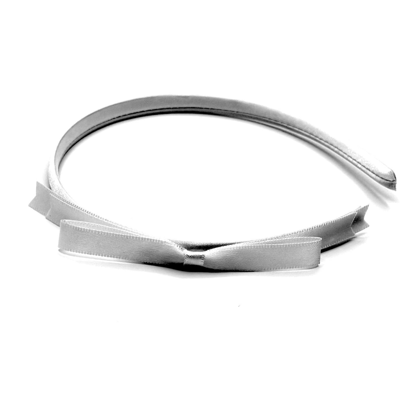bow view of white satin bow headband on white background