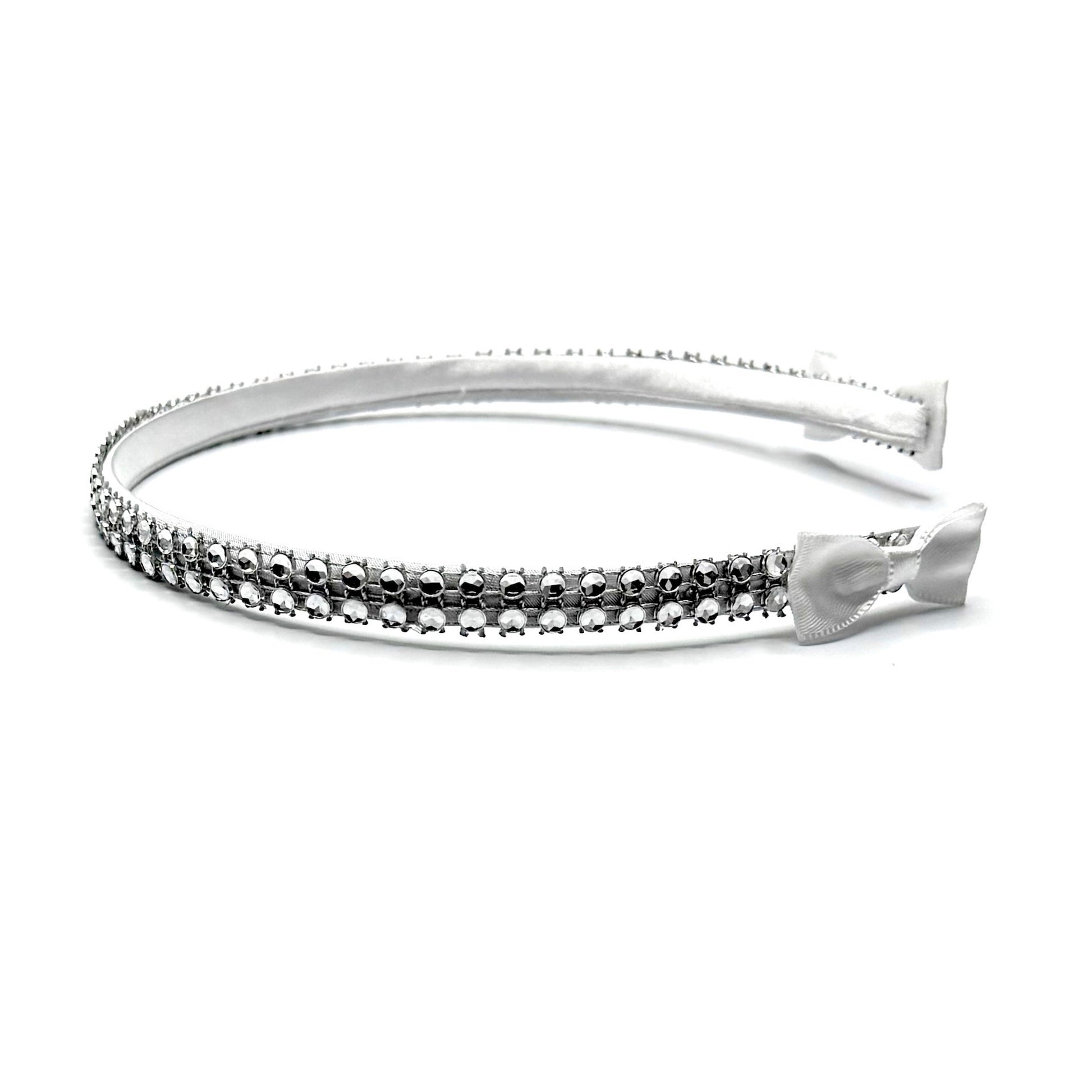 White Sparkly Headband with White and Silver Rhinestone Metsh with White Bows on the ends on a White Background Side View