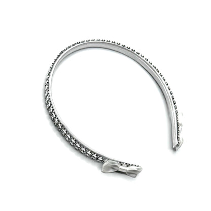 White Sparkly Headband with White and Silver Rhinestone Metsh with White Bows on the ends on a White Background