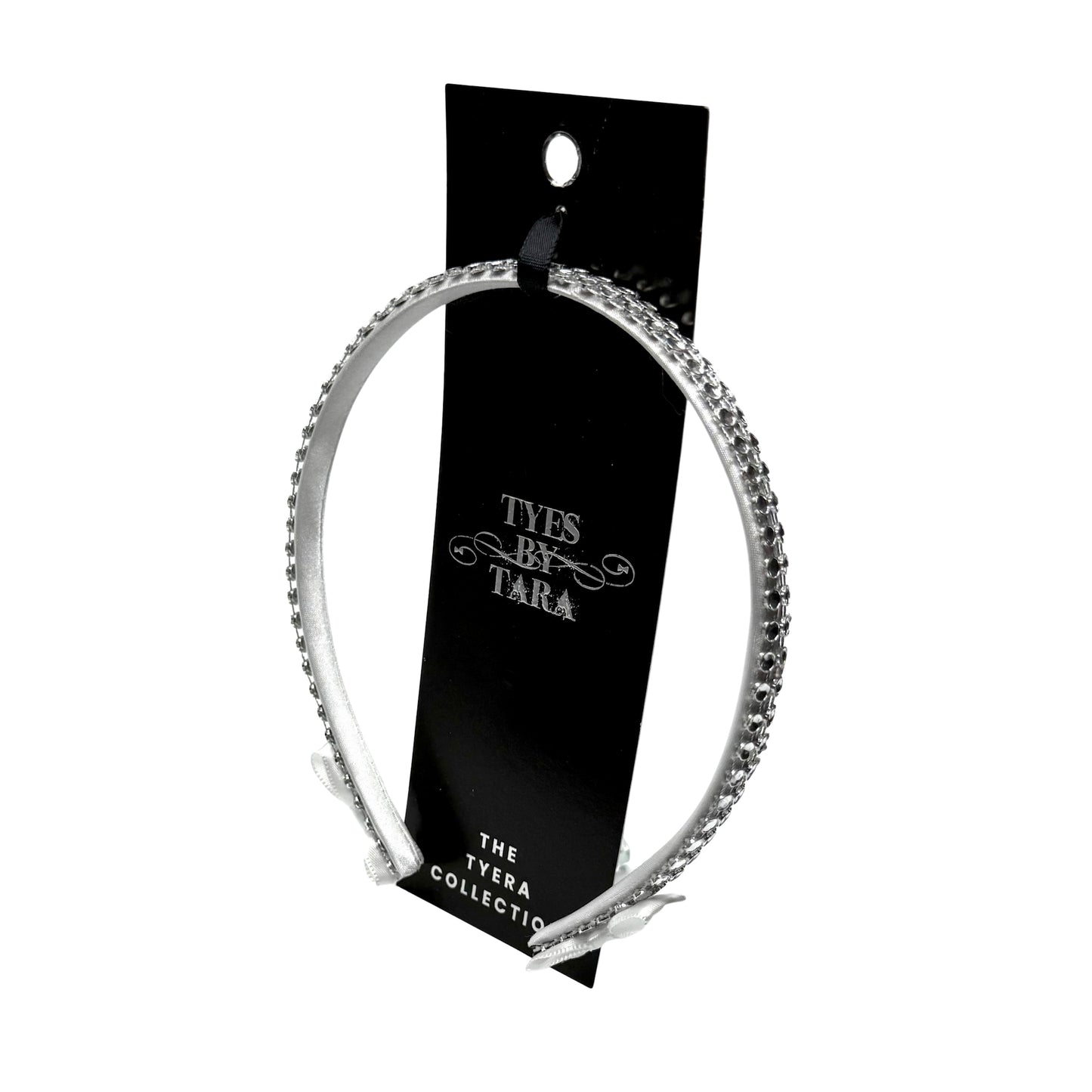 White Sparkly Headband with White and Silver Rhinestone Metsh with White Bows on the ends on a White Background Packaging View