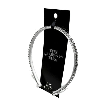 White Sparkly Headband with White and Silver Rhinestone Metsh with White Bows on the ends on a White Background Packaging View