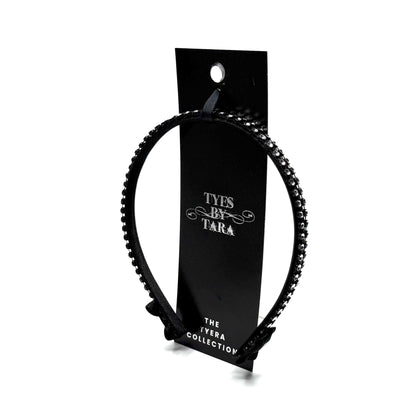 Black hairband with black and silver rhinestone mesh with black bows at the end on white background Packaging View