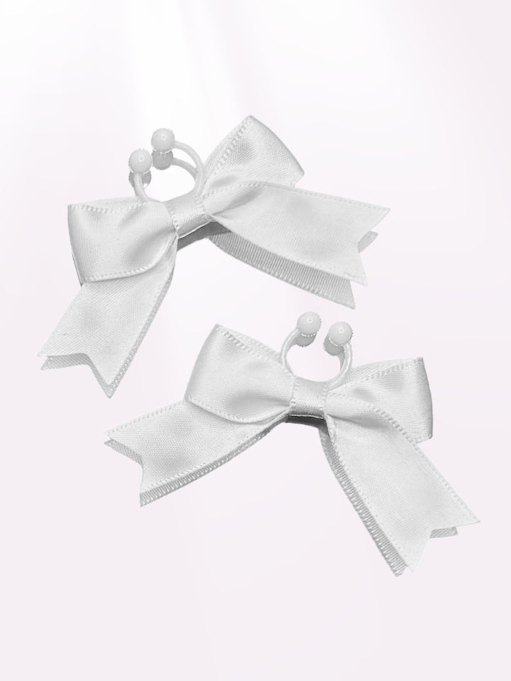 White Bow Nipple Jewelry Accessories on Light Pink Background