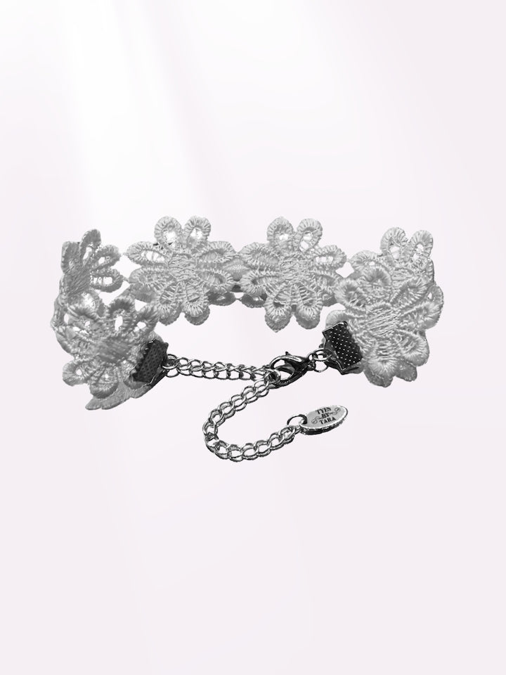 back view of white flower bow bracelet 